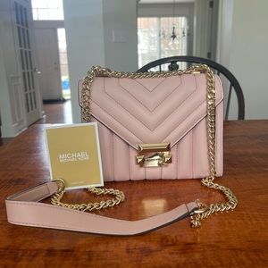 Brand new! Michael Kors crossbody purse. Light pink with gold chain hardware
